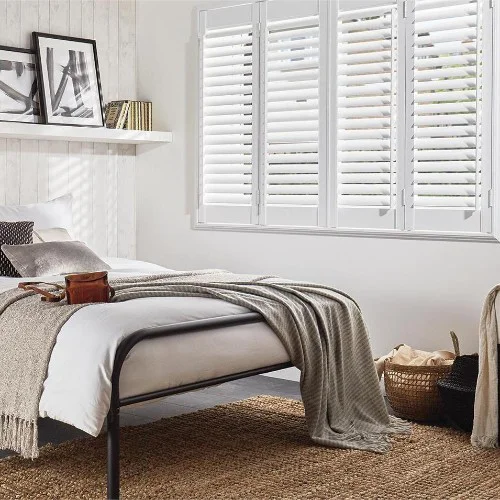 https://postmyblinds.co.uk/hub/blinds/shutter-blind/moira-cotton-white-shutter-blind-3.webp